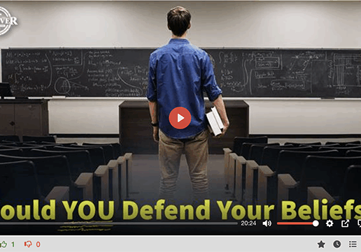 Student in empty lecture hall facing chalkboard